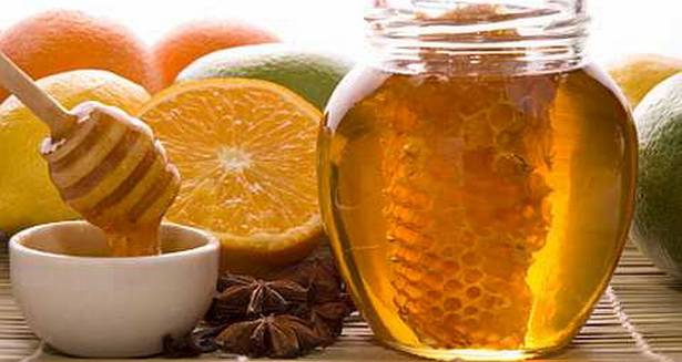 fresh honey with honeycomb, spices and fruits