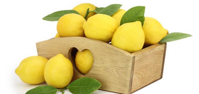 Wooden box full of lemons