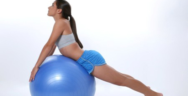 Teen Girl Stretching on Exercise Ball