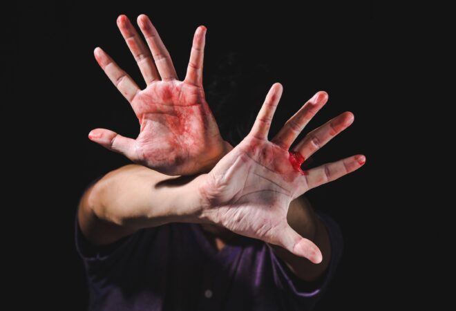 Hand defending victim of human trafficking for stop violence and abuse human trafficking harassment against rape