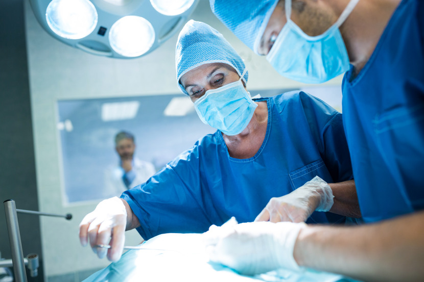 surgeons-performing-operation-operation-room-830x0