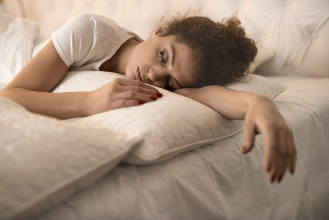 tired-woman-sleeping-in-bed