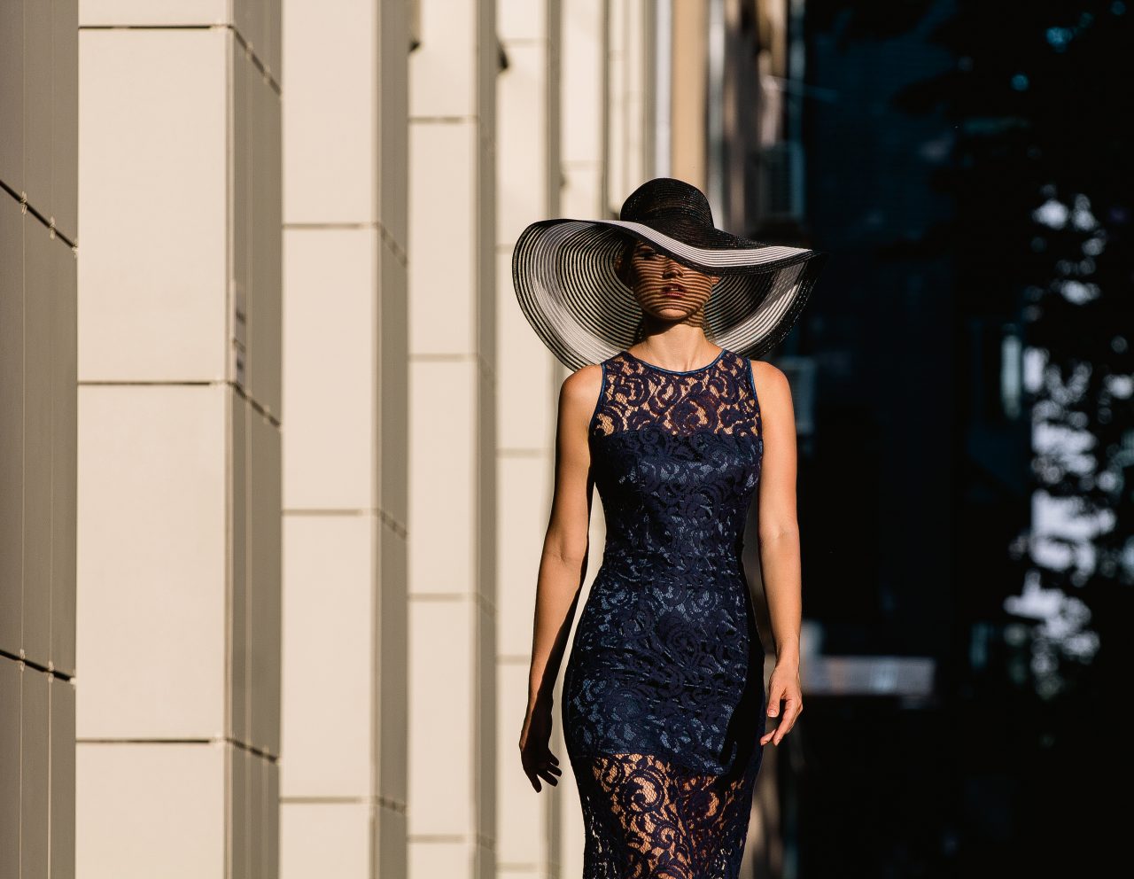 Young,Woman,In,Black,Lace,Dress,And,A,Hat,With