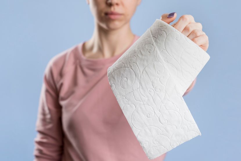 front-view-woman-holding-toilet-paper-roll-830x0