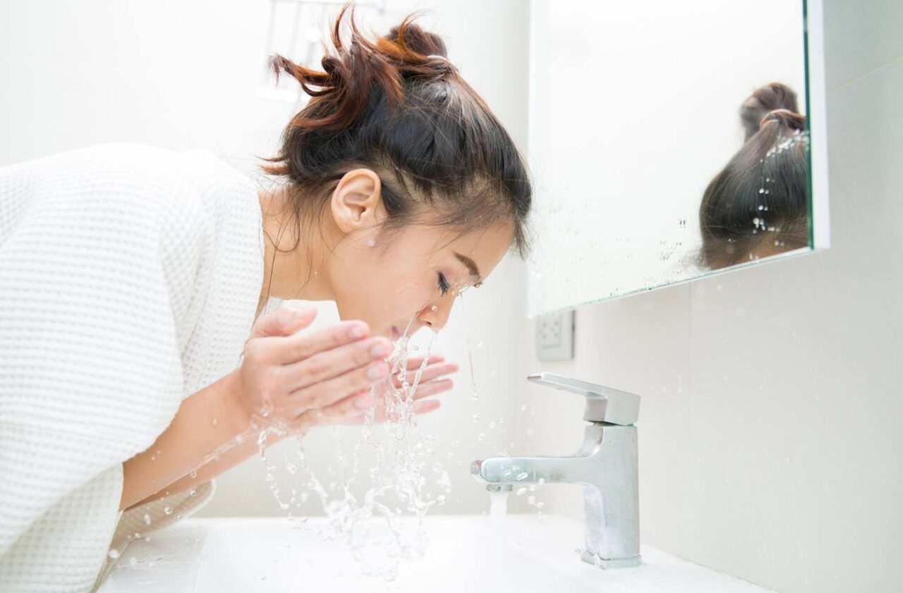 GettyImages-woman-water-face-Towai