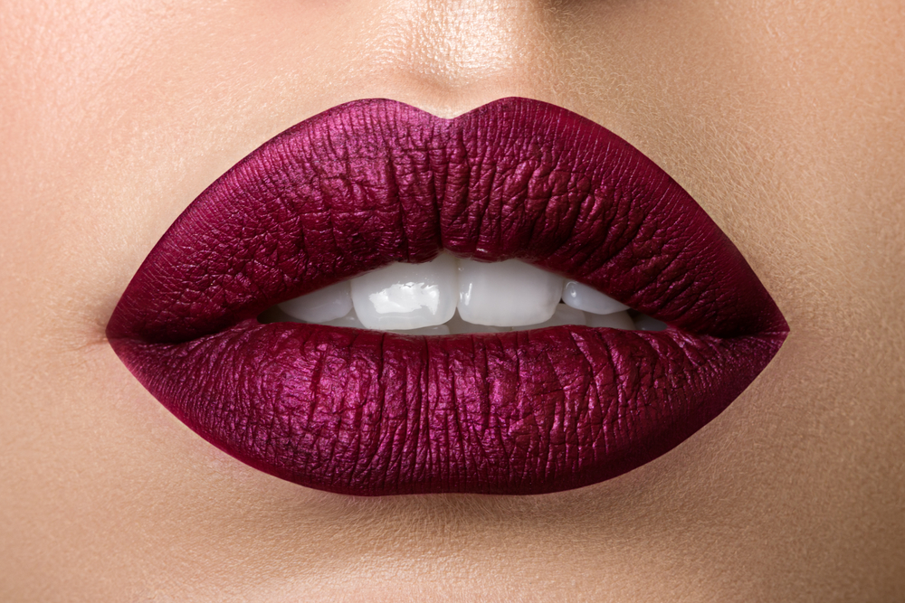 Close,Up,View,Of,Beautiful,Woman,Lips,With,Purple,Matt