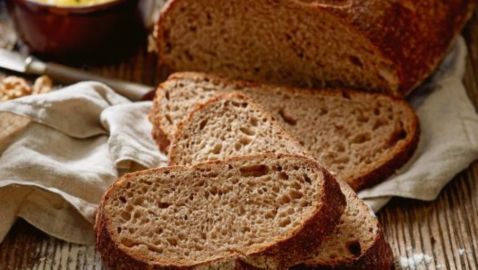 732768_stock-photo-slices-of-rustic-sourdough-bread-on-wooden-table-658050610_f