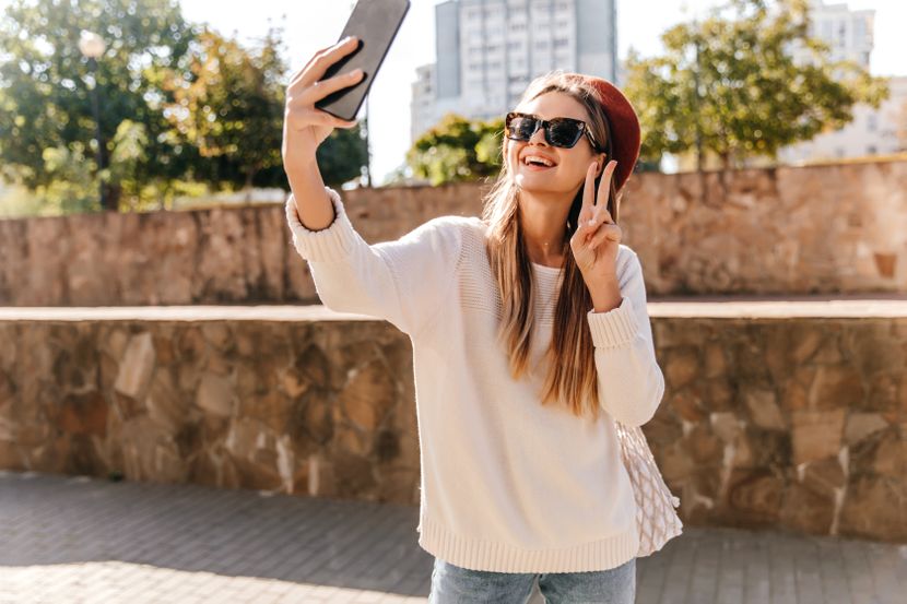 excited-french-girl-with-long-hairstyle-making-selfie-outdoor-photo-magnificent-laughing-lady-posing-with-smartphone-830x0