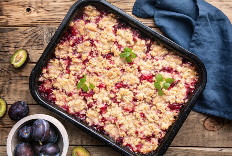 Juicy,Plum,Pie,Slices,With,Crunchy,Streusel,Topping,On,Rustic