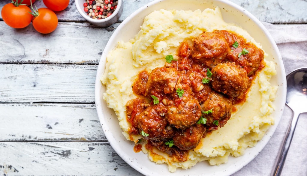67987_stock-photo-meatballs-in-tomato-sauce-with-mashed-potato-on-the-white-plate-top-view-view-from-above-smanjena-1606310743_f