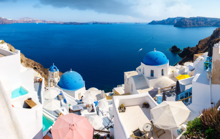 1717567624-1717488058-santorini-greece-panoramic-view-of-traditional-h-2023-11-27-04-49-10-utc-750x476