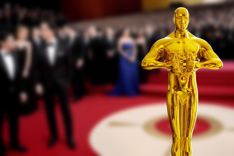 Hollywood,Golden,Oscar,Academy,Award,Statue,In,The,Hand,At