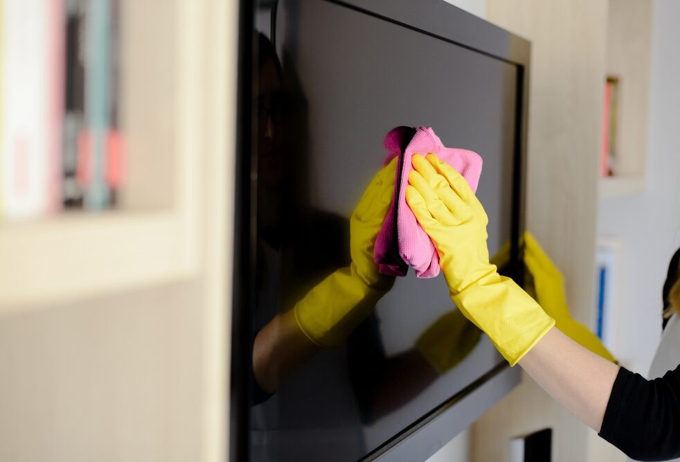 Woman,In,Yellow,Rubber,Gloves,Cleaning,Tv,With,Pink,Cloth