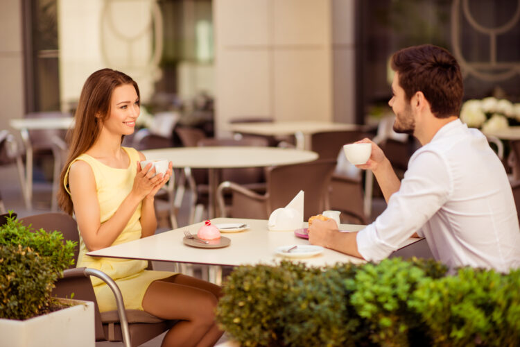 Yummy,Morning.,Two,Cute,Lovers,Are,Sitting,In,Light,Cafe