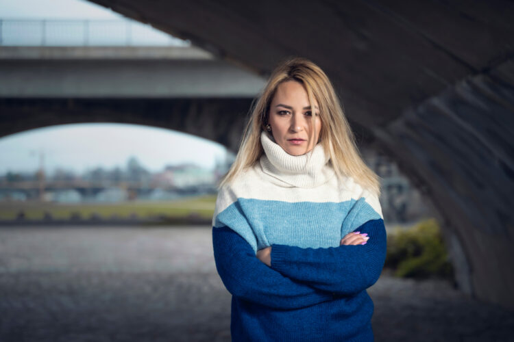 Urban,Portrait,Of,A,Woman,,With,Blonde,Hair,,Who,Looks