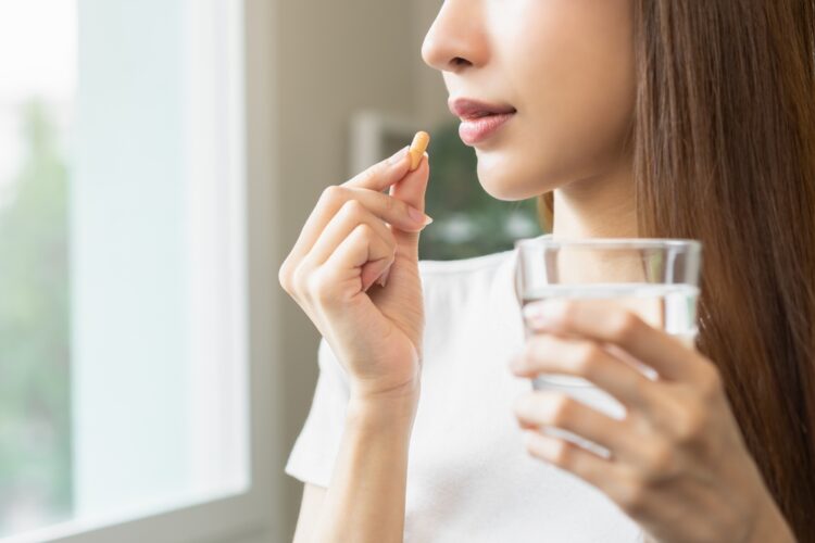 Dietary,Supplement,,Asian,Young,Woman,,Girl,Hand,Holding,Orange,Medical