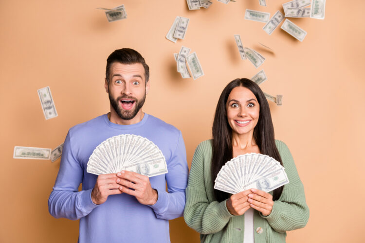 Photo,Of,Impressed,Couple,Hold,Money,Wear,Sweater,Isolated,On