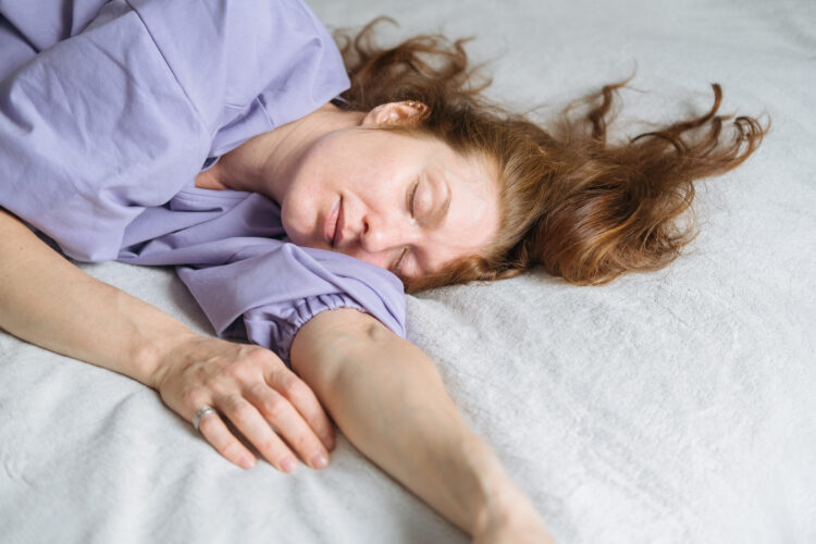 Woman Asleep in Bed