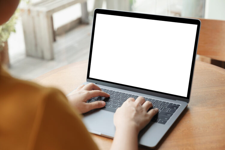 Young,Women,Working,On,Her,Laptop,With,Blank,Copy,Space